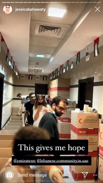 In the Emirates Red Crescent branch in Al Garhoud, volunteers have made a human chain to move and pack goods. Instagram/ @JessicaKahawaty