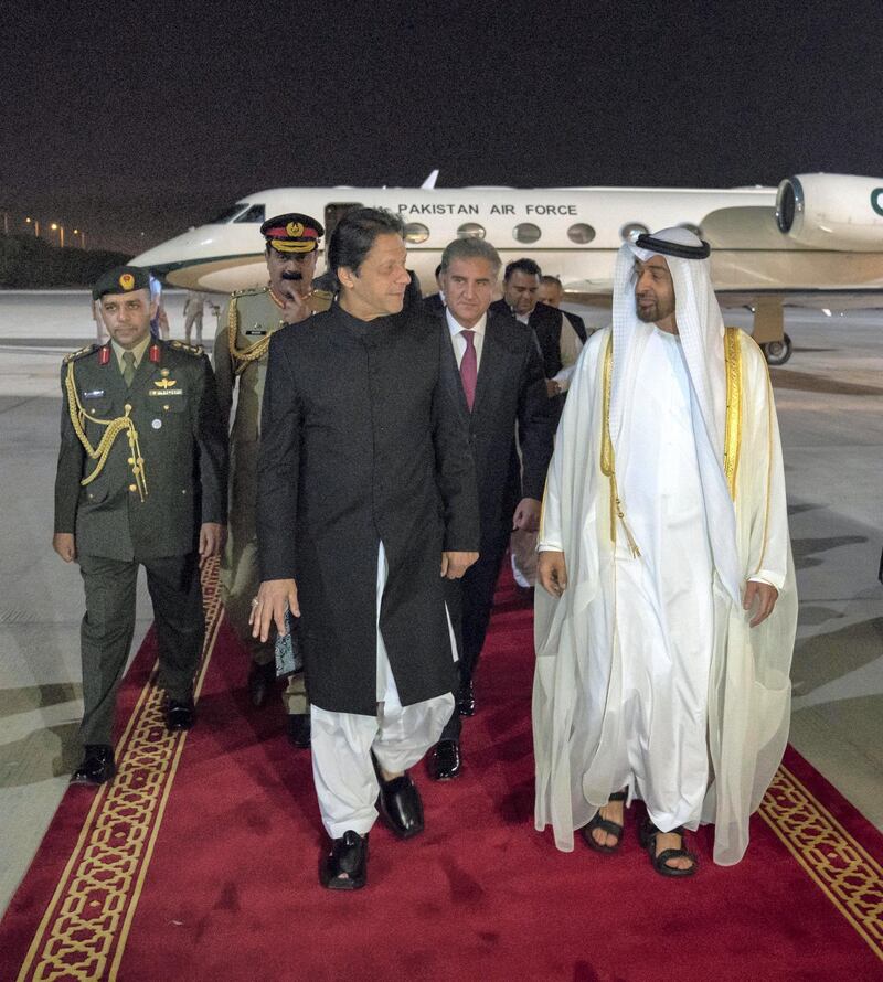 ABU DHABI, UNITED ARAB EMIRATES - September 19, 2018: HH Sheikh Mohamed bin Zayed Al Nahyan Crown Prince of Abu Dhabi Deputy Supreme Commander of the UAE Armed Forces (R), receives HE Imran Khan Prime Minister of Pakistan (L), during a reception at the Presidential Airport. 

( Hamad Al Kaabi / Crown Prince Court - Abu Dhabi )
---