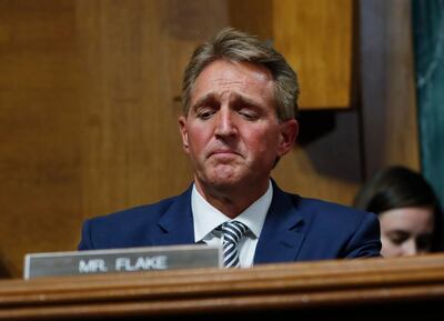 Sen. Jeff Flake, R-Ariz., after speaking during the Senate Judiciary Committee hearing about an investigation, Friday, Sept. 28, 2018 on Capitol Hill in Washington. After a flurry of last-minute negotiations, the Senate Judiciary Committee advanced Brett Kavanaugh's nomination for the Supreme Court after agreeing to a late call from Sen. Flake for a one week investigation into sexual assault allegation against the high court nominee. (AP Photo/Pablo Martinez Monsivais)