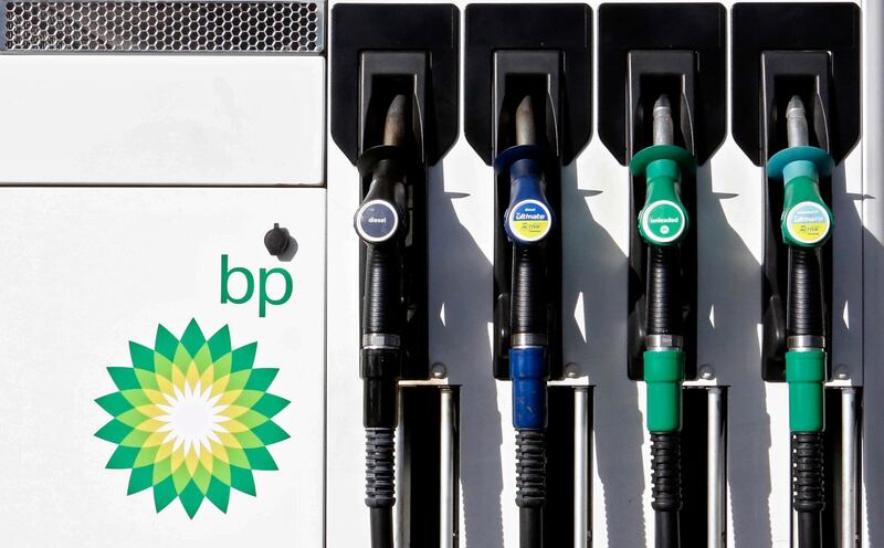 FILE - In this file photo dated Tuesday, Aug. 1, 2017, a car fuel pump at a BP petrol station in London.  Oil producer BP released second-quarter 2020 earnings figures Tuesday Aug. 4, 2020, saying it plans to slash dividends as the global oil company prepares for declining sales of fossil fuels. (AP Photo/Caroline Spiezio, FILE)