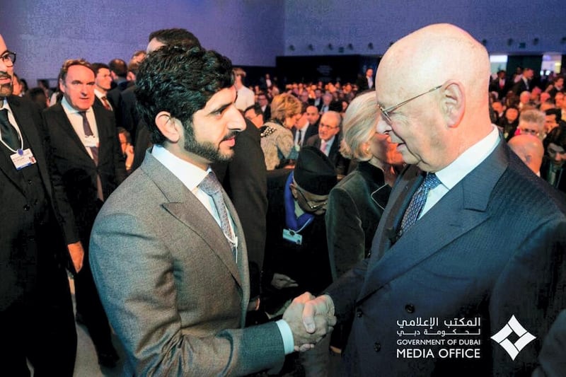 Sheikh Hamdan bin Mohammed shakes hands with Klaus Schwab at the World Economic Forum at Davos.