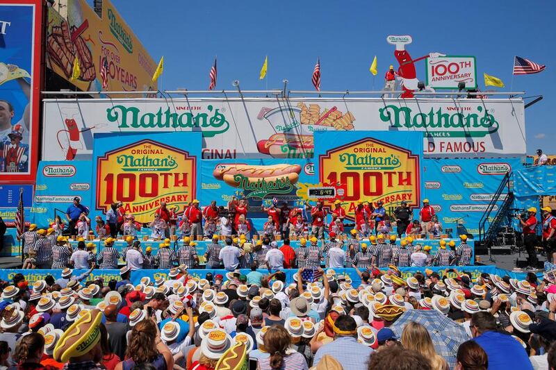 Female contestants compete during the hot dog-eating contest. Andrew Kelly / Reuters