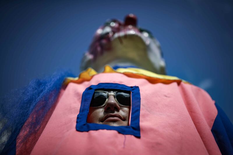 A man takes part in a carnival parade as part of New Year's Eve festivities in San Jose, Costa Rica. EPA