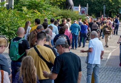 People queue to vote in Berlin. AP