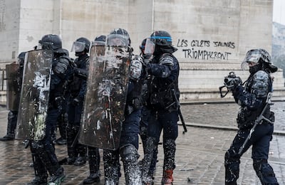 Riot police clash with protesters during a Yellow Vest demonstration near the Arc de Triomphe in December 2018. Getty Images