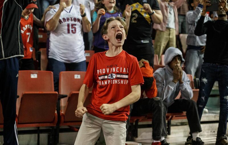 Fans in Edmonton, Alberta, cheer as they watch the Toronto Raptors defeat the Golden State Warriors 114-110. AP Photo