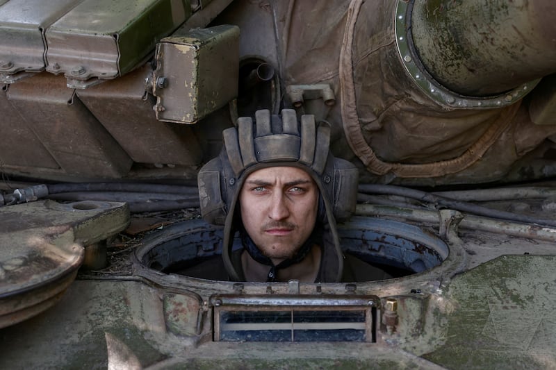 A Ukrainian soldier looks on from inside a tank at a position in the breakaway Donetsk enclave, as Russia's attack on Ukraine continues. Reuters