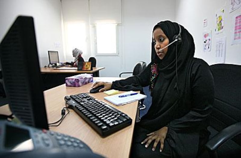 Helpline worker Khadra Hassan fields calls from victims of domestic abuse at the Dubai Foundation for Women and Children.