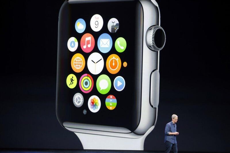 Tim Cook with the new Apple Watch. Stephen Lam / Reuters