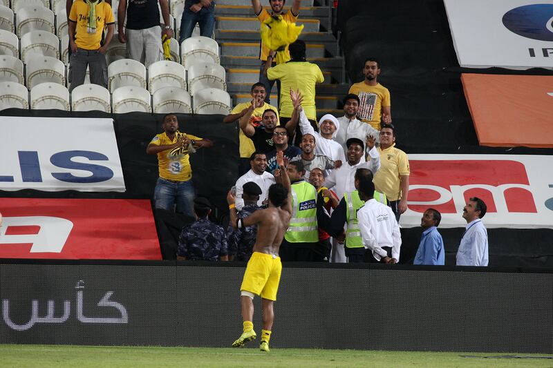 ABU DHABI , UNITED ARAB EMIRATES Ð Oct 15 : Waheed Ismail ( no 6 ) of Al Wasl giving his t-shirt to his fans after the Etisalat Cup round 3 football match between Al Wasl vs Al Jazira at Mohammad Bin Zayed stadium in Abu Dhabi.  Al Wasl won the match by 3-2. ( Pawan Singh / The National ) For Sports. Story by Amit