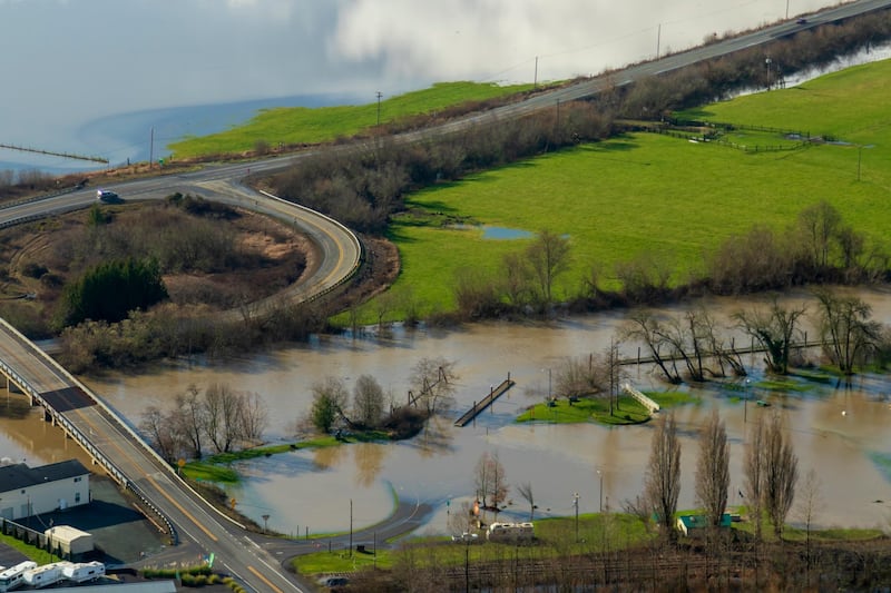 An aerial photo provided by Rena Olson of flooding from an extreme high tide is seen near the Coquille River in southwest Oregon taken as part of the Oregon King Tides Project. AP