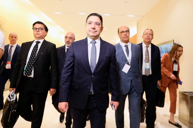 Moroccan Foreign Minister Nasser Bourita, centre, arrives in Algiers to attend the summit. AP