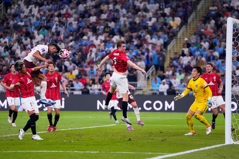 Manchester City's Matheus Nunes, top left, heads the ball wide. AP