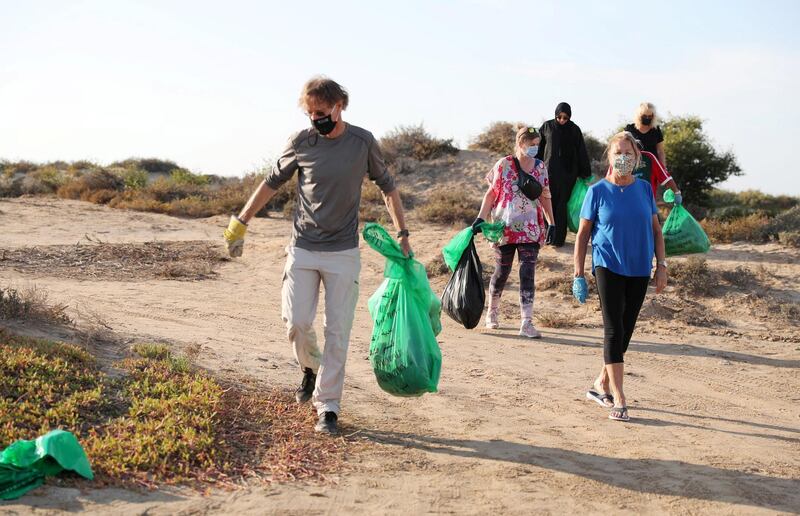 UAQ, UNITED ARAB EMIRATES , Feb 02 – Fatima Alzaabi, Ruth Fitz-Gerald, Tony Fitz-Gerald, Maria Lundberg, Pia Yun and Paul Rivers after picking trash during the clean-up drive at the beach in Umm Al Quwain. (Pawan Singh / The National) For News/Stock/Online/Instagram/Standalone/Big Picture. Story by Patrick