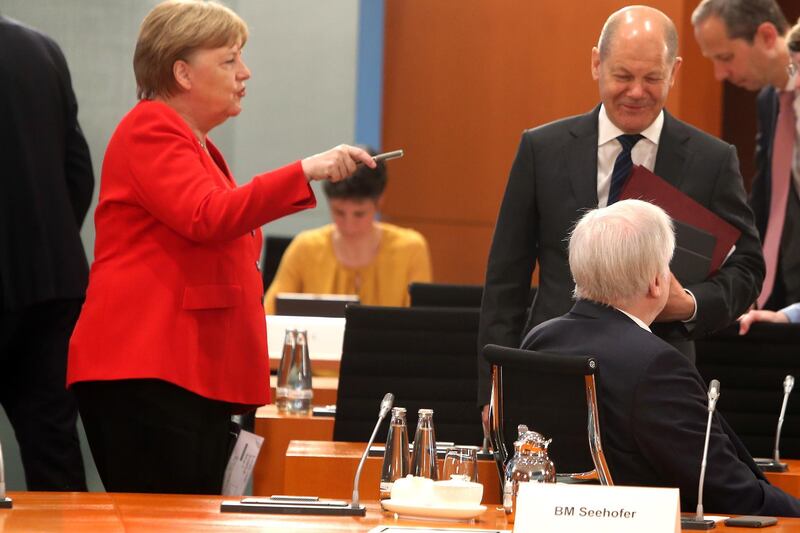 epa08404477 German Chancellor Angela Merkel with Minister of Finance and Vice Chancellor Olaf Scholz and Minister of the Interior, Building and Community Horst Seehofer during Cabinet meeting of the German Government in Berlin, Germany, 06 May 2020.  EPA/MIKA SCHMIDT / POOL