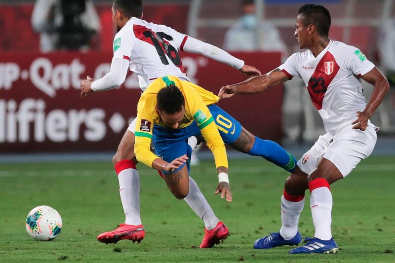 Neymar is grabbed by the  jersey by Peru's Pedro Aquino. AFP
