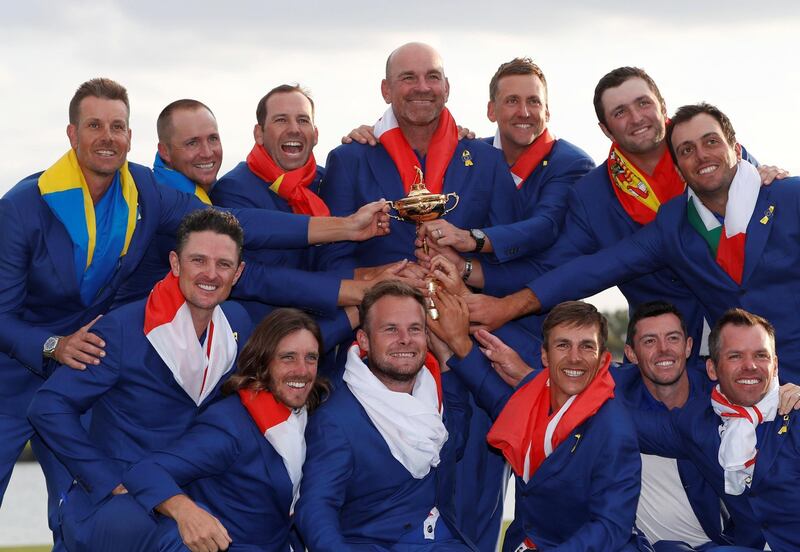 Golf - 2018 Ryder Cup at Le Golf National - Guyancourt, France - September 30, 2018 - Team Europe captain Thomas Bjorn and his team pose with the trophy after winning the Ryder cup REUTERS/Paul Childs      TPX IMAGES OF THE DAY