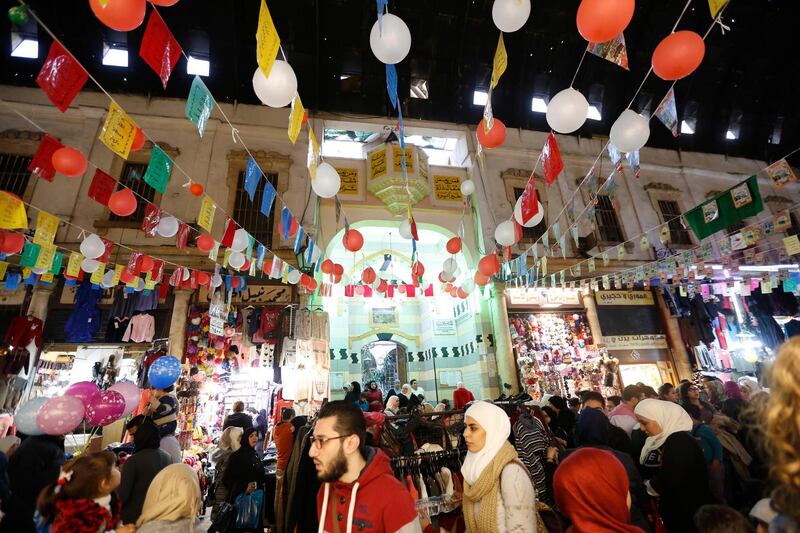 People crowd at the Al-Hamidiyah Souq decorated for the Mawlid, the birthday of Prophet Mohammad, celebrations in the Old City in Damascus.  EPA