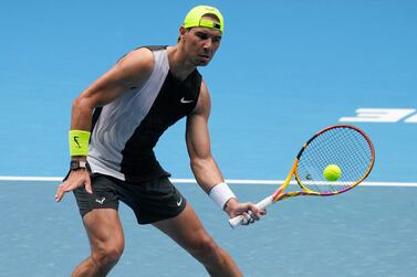Spain's Rafael Nadal plays a forehand return to Canada's Felix Auger-Aliassime during a practice session on Rod Laver Arena ahead of the Australian Open tennis championship in Melbourne, Australia, Friday, Jan.  13, 2023.  (AP Photo / Mark Baker)