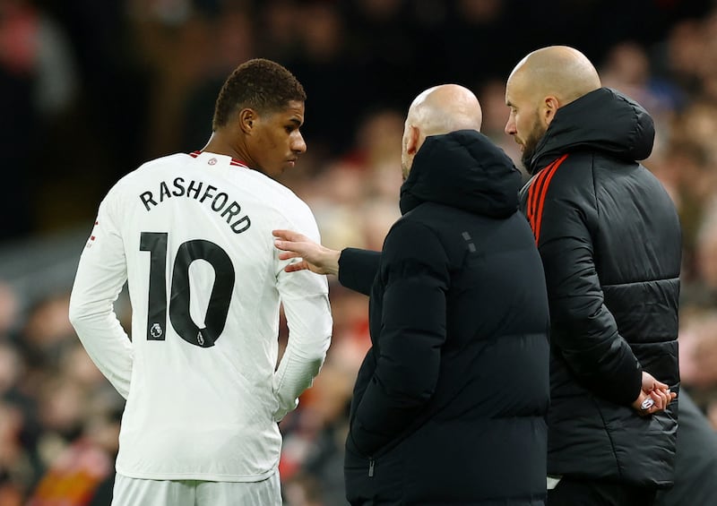 Manchester United manager Erik ten Hag gives instructions to Marcus Rashford before he comes on as a substitute. Reuters