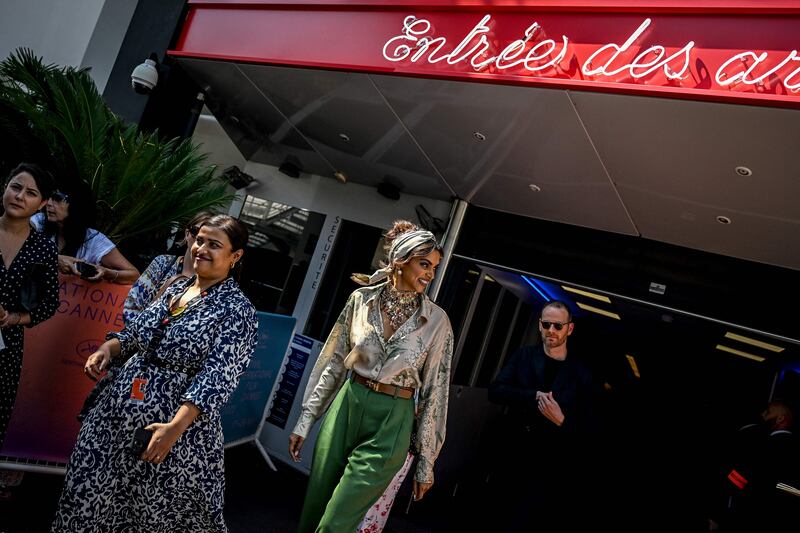 Deepika Padukone leaves the Festival Palace after attending a photocall and a press conference during the 75th edition of the Cannes Film Festival in Cannes. AFP