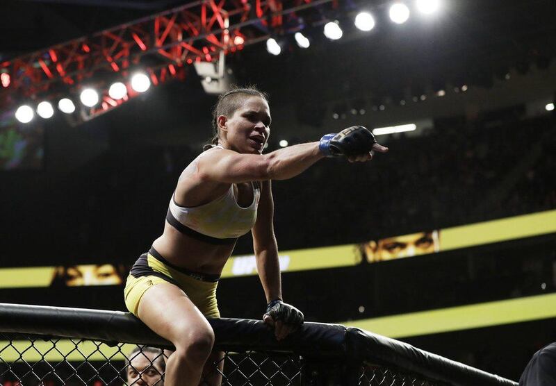 Amanda Nunes celebrates after defeating Miesha Tate during their women's bantamweight championship mixed martial arts bout at UFC 200, Saturday, July 9, 2016, in Las Vegas. (AP Photo/John Locher)