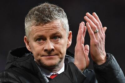 Manchester United's  Norwegian caretaker manager Ole Gunnar Solskjaer applauds the fans following the first leg of the UEFA Champions League round of 16 football match between Manchester United and Paris Saint-Germain (PSG) at Old Trafford in Manchester, north-west England on February 12, 2019. PSG won the match 2-0. / AFP / Paul ELLIS
