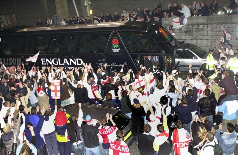 Fans surround the coach carrying the England rugby team at Heathrow, as they arrived from Sydney after winning the World Cup in 2003