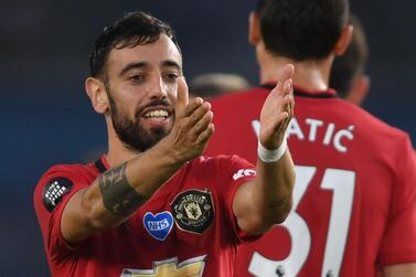 Manchester United's Portuguese midfielder Bruno Fernandes celebrates scoring their second goal during the English Premier League football match between Brighton and Hove Albion and Manchester United at the American Express Community Stadium in Brighton, southern England on June 30, 2020. RESTRICTED TO EDITORIAL USE. No use with unauthorized audio, video, data, fixture lists, club/league logos or 'live' services. Online in-match use limited to 120 images. An additional 40 images may be used in extra time. No video emulation. Social media in-match use limited to 120 images. An additional 40 images may be used in extra time. No use in betting publications, games or single club/league/player publications. / AFP / POOL / Mike Hewitt / RESTRICTED TO EDITORIAL USE. No use with unauthorized audio, video, data, fixture lists, club/league logos or 'live' services. Online in-match use limited to 120 images. An additional 40 images may be used in extra time. No video emulation. Social media in-match use limited to 120 images. An additional 40 images may be used in extra time. No use in betting publications, games or single club/league/player publications.
