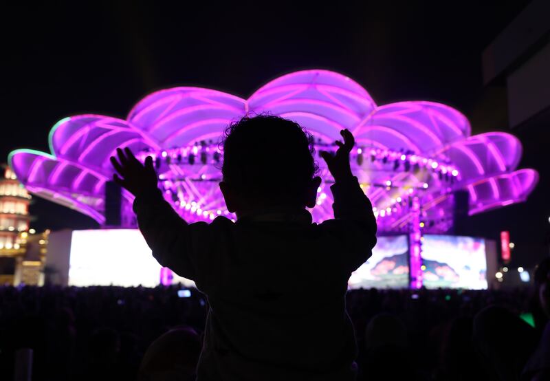 A young visitor watches the performances during New Years Eve at Global Village, Dubai. Chris Whiteoak / The National