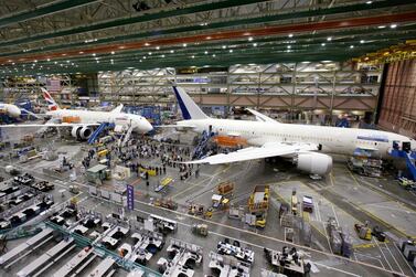 A line of Boeing 787 jets sit on the floor nearing completion at the company's production plant in Everett, Wash. The company updated its forecast of the airplane market on October 6, 2020. It remains upbeat about long-term prospects driven by increasing air travel in Asia. AP.