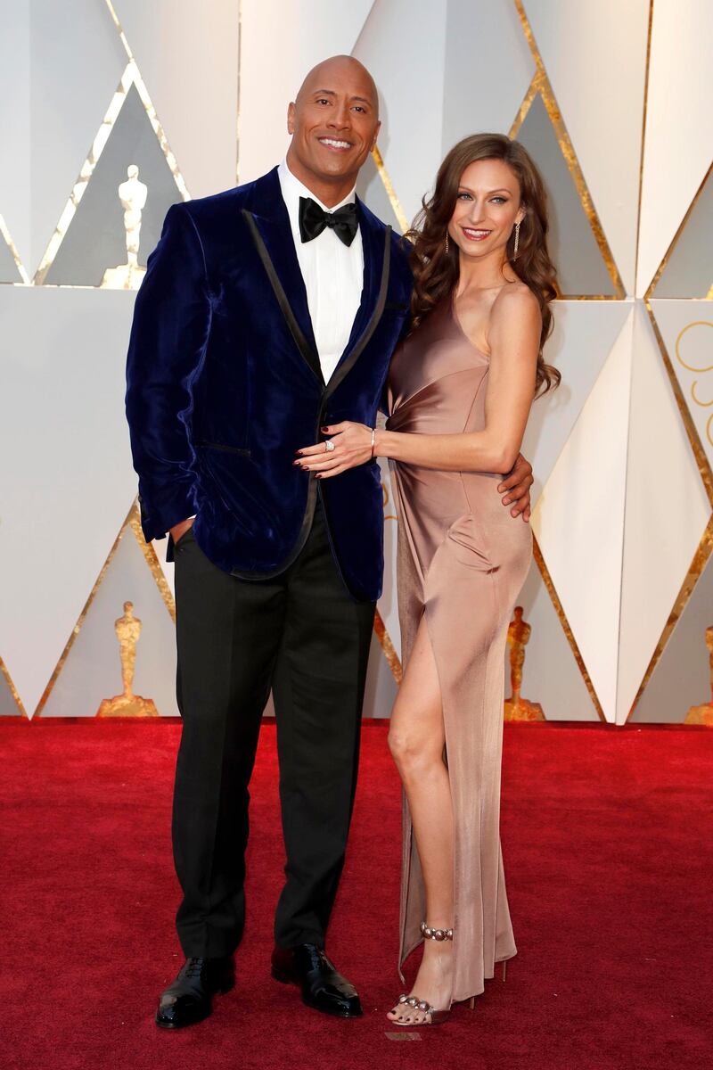 epa05817524 Dwayne Johnson (L) and Lauren Hashian arrive for the 89th annual Academy Awards ceremony at the Dolby Theatre in Hollywood, California, USA, 26 February 2017. The Oscars are presented for outstanding individual or collective efforts in 24 categories in filmmaking.  EPA/MIKE NELSON
