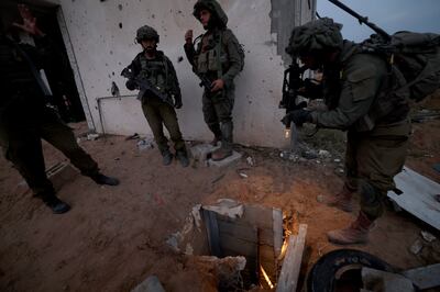 Israeli soldiers standing at the entrance to a tunnel in the Palestinian refugee camp of Jabalia, on the outskirts of Gaza city. EPA
