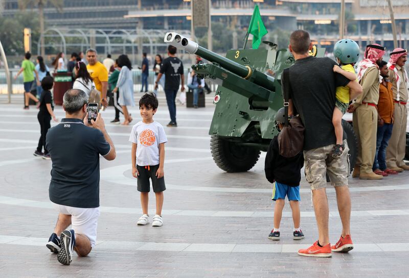 Spectators at the cannon firing at Burj Park, Dubai, on the last day of Ramadan. Chris Whiteoak / The National