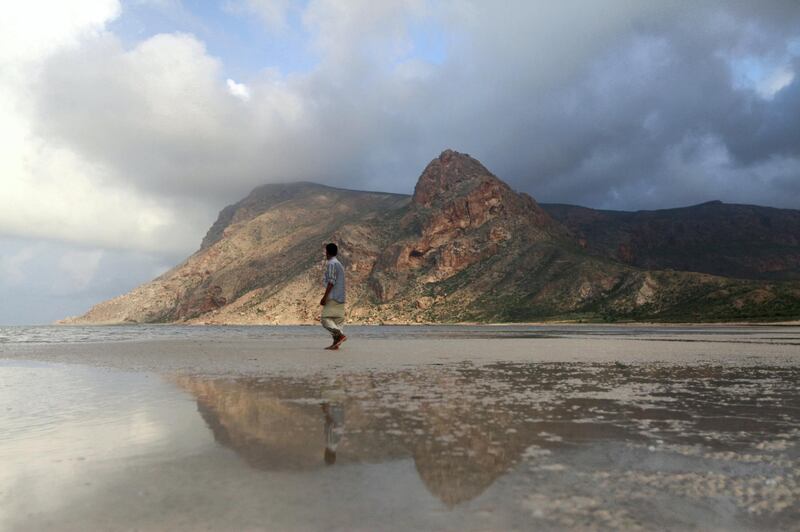 A local guide walks on the approach to Ditwa lagoon and beach near the port of Qalensiya, the second biggest town on Yemen's Socotra island November 21, 2013. The Socotra islands, in the Arabian Sea 380 km south of mainland Yemen and 80 km west of the Horn of Africa, harbour many unique species of birds and plants and gained UNESCO recognition in July 2008 as a world natural heritage site. REUTERS/Mohamed al-Sayaghi (YEMEN - Tags: TRAVEL ANIMALS) - GM1E9BM02B901