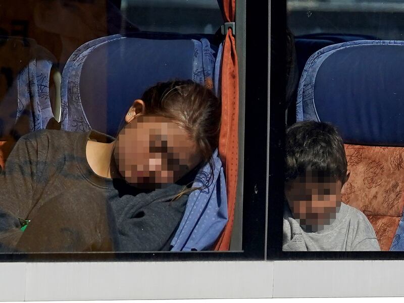 Children are driven from the Border Force compound in Dover, Kent, after being rescued from the Channel on August 23, 2023. PA