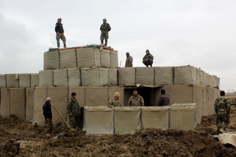 (FILES) In this file photo taken on March 4, 2020, Afghan security forces stand guard at an Afghan National Army (ANA) outposts after an attack by  Taliban militants, in Kunduz Province.  The Taliban will hold talks with the Afghan government on September 11, 2020, but it will be no easy task for the foes to bridge their ideological differences and resolve the bitter legacy of two decades of war. / AFP / STR
