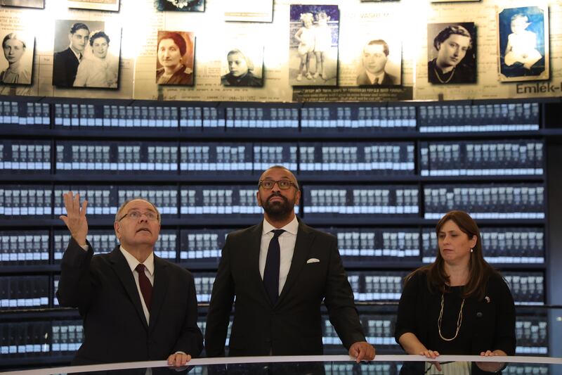 British Foreign Secretary James Cleverly (centre), chairman of Yad Vashem Dani Dayan (left) and Israeli Ambassador to the UK Tzipi Hotovely visit the Hall Of Names at Yad Vashem Holocaust Memorial museum in Jerusalem. EPA