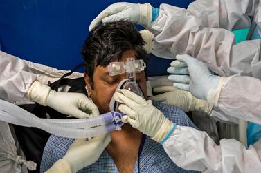 Doctors and nurses treat a Covid-19 patient in the Intensive Care Unit of Sharda Hospital in the Greater Noida area near India's capital New Delhi. AFP