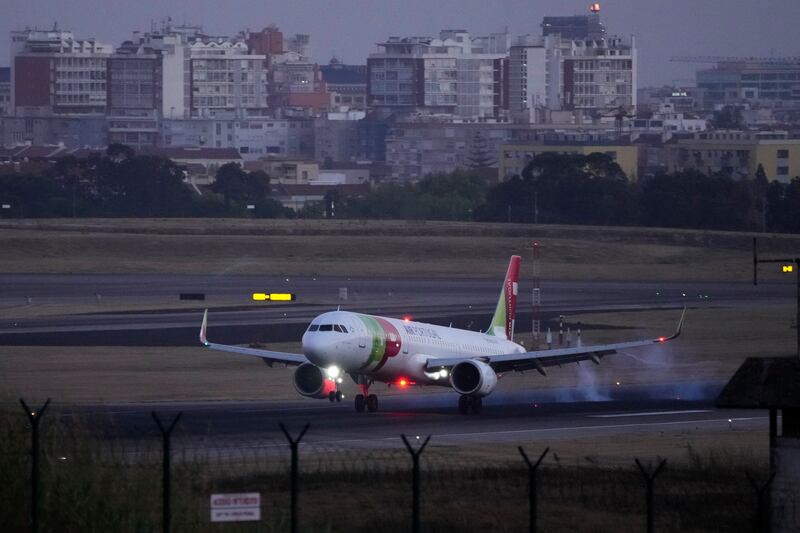 An Air Portugal plane lands at Lisbon airport on Friday. AP