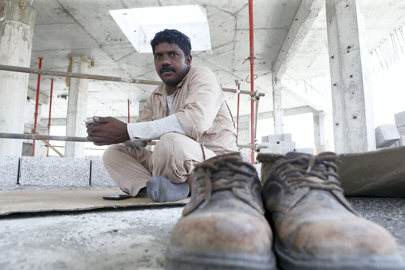 DUBAI , UNITED ARAB EMIRATES , AUG 8 – 2017 :- Nageshwar Rao from India taking rest during the midday break at the construction site in Al Warqa area in Dubai. ( Pawan Singh / The National ) Story by Nawal Ail Ramahi