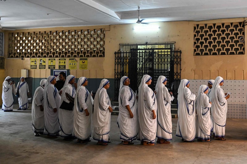 In Kolkata, nuns from Missionaries of Charity queue to cast their ballot at a polling station in the seventh and final phase of voting in India's general election on Saturday June 1. AFP