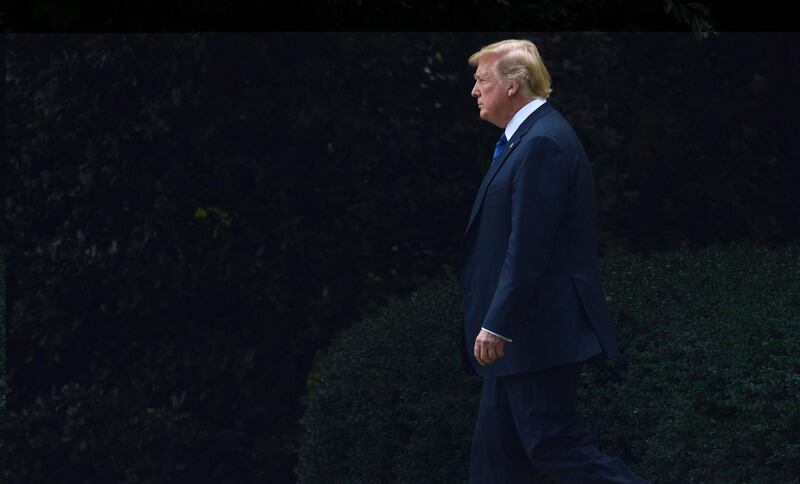 In this July 20, 2018, photo, President Donald Trump walks from the Oval Office of the White House in Washington, to board Marine One for a short trip to Andrews Air Force Base, Md., en route to Bedminster N.J., for the weekend. (AP Photo/Susan Walsh)