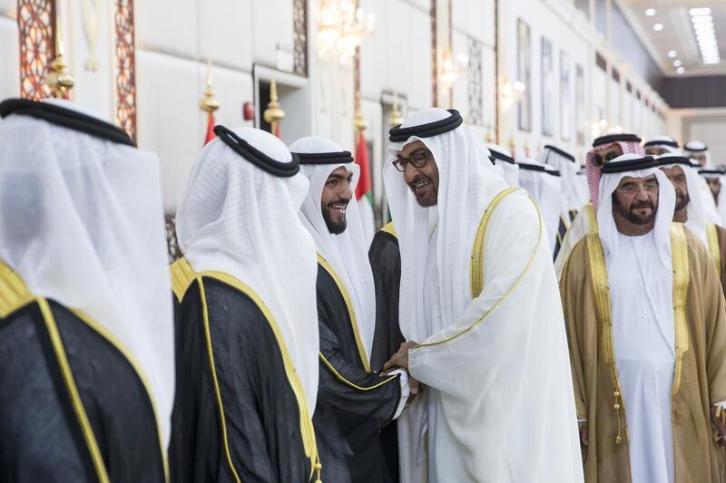 Sheikh Mohammed bin Zayed, Crown Prince of Abu Dhabi and Deputy Supreme Commander of the Armed Forces, greets grooms during a group wedding at Mushrif Palace. Seen with Sheikh Saif bin Mohammed. Ryan Carter / Crown Prince Court - Abu Dhabi