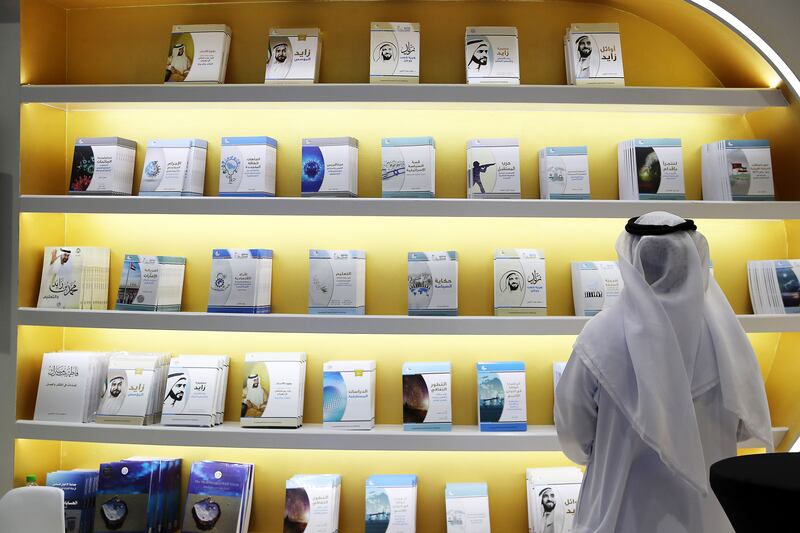 A visitor on the first day of the Abu Dhabi Book Fair. Last year, more than 152,000 people visited the event at which over 165,000 books were sold. Pawan Singh / The National