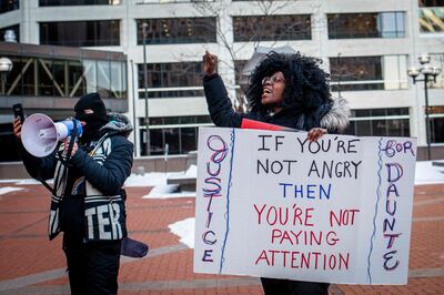 Ashley Dorelus and Tanya James demonstrate outside the Hennepin County Government Centre in Minneapolis, Minnesota, last December during jury deliberations in the trial of former police officer Kim Potter. AFP