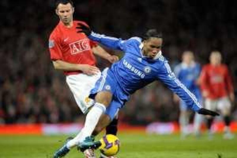 MANCHESTER, UNITED KINGDOM - JANUARY 11:  Didier Drogba of Chelsea tangles with Ryan Giggs of Manchester United during the Barclays Premier League match between  Manchester United and Chelsea at Old Trafford on January 11, 2009 in Manchester, England.  (Photo by Darren Walsh/Getty Images) *** Local Caption *** Ryan Giggs;Didier Drogba