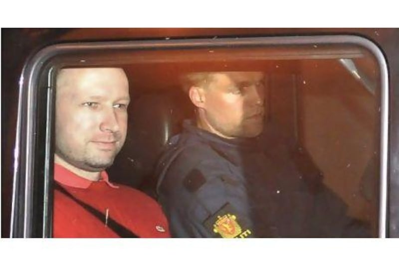 The bomb and terror suspect Anders Behring Breivik leaves court in Oslo on July 25 in a police car.