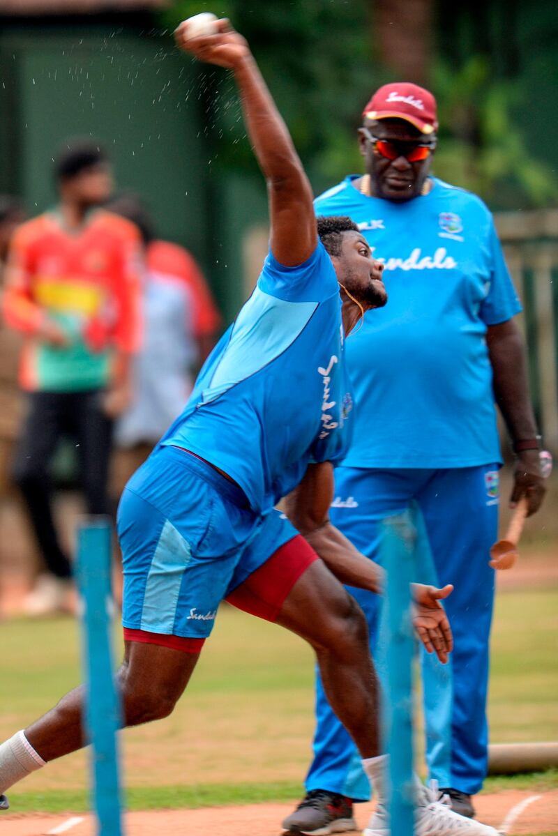 West Indies' Romario Shepherd bowls in Chennai. AFP
