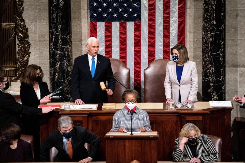 US Vice President Mike Pence and House Speaker Nancy Pelosi preside over a joint session of Congress to certify the 2020 Electoral College results after supporters of President Donald Trump stormed the Capitol earlier in the day on Capitol Hill in Washington, DC. EPA